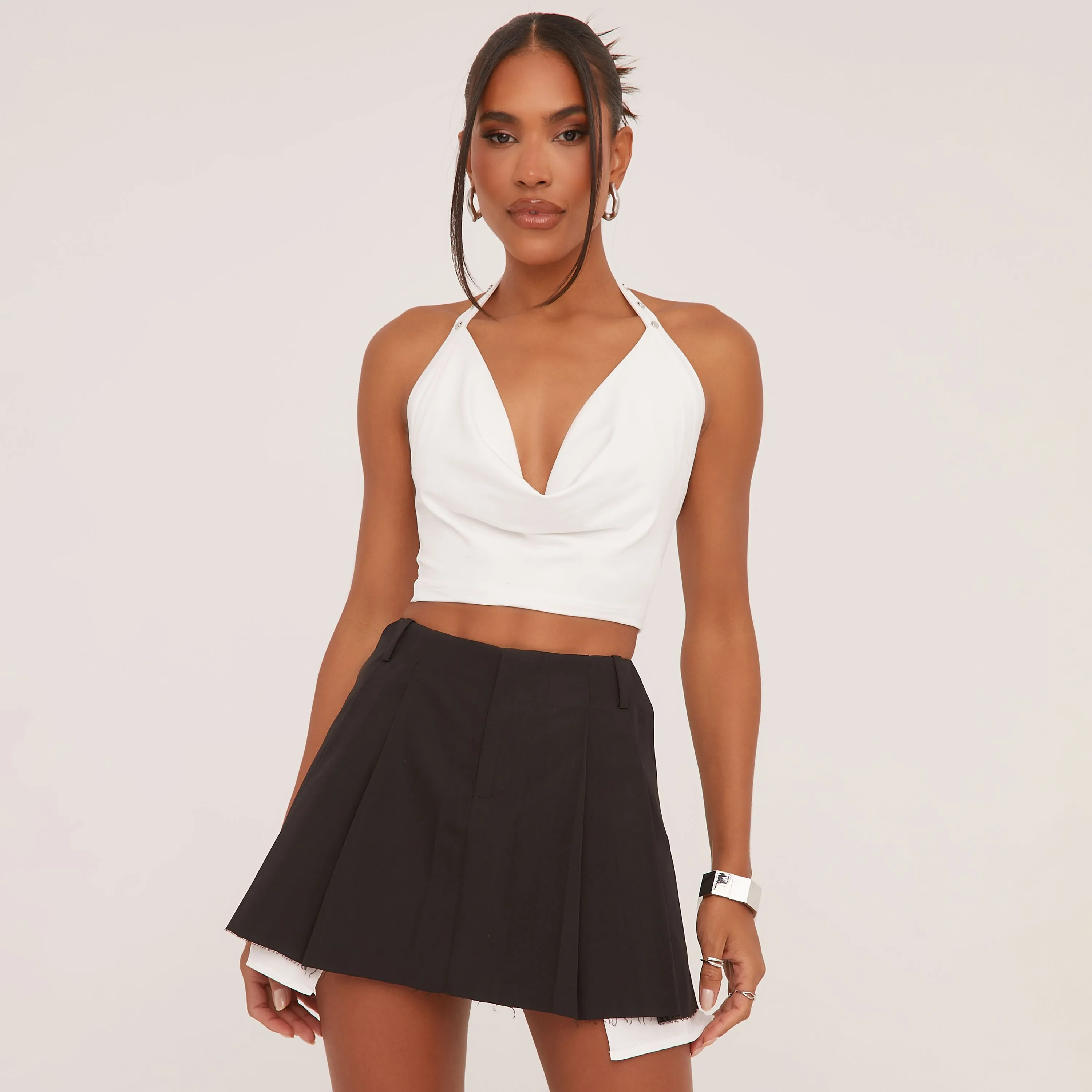 High Waist Raw Hem Pleated Mini Skirt In Black